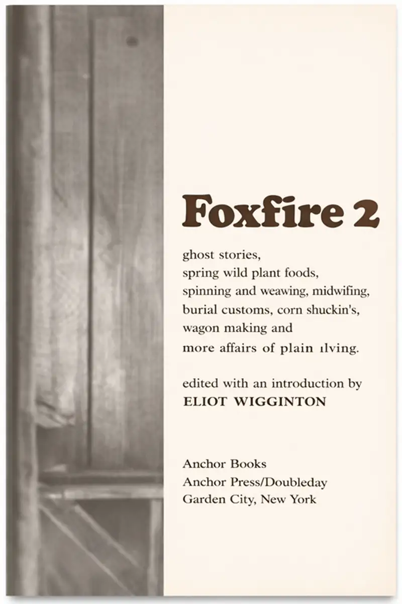 Foxfire Book Volume 2 cover showing traditional Appalachian plain living topics, including wild plant foods, spinning and weaving, midwifery, wagon making, and community customs, presented in a clean vintage-style design